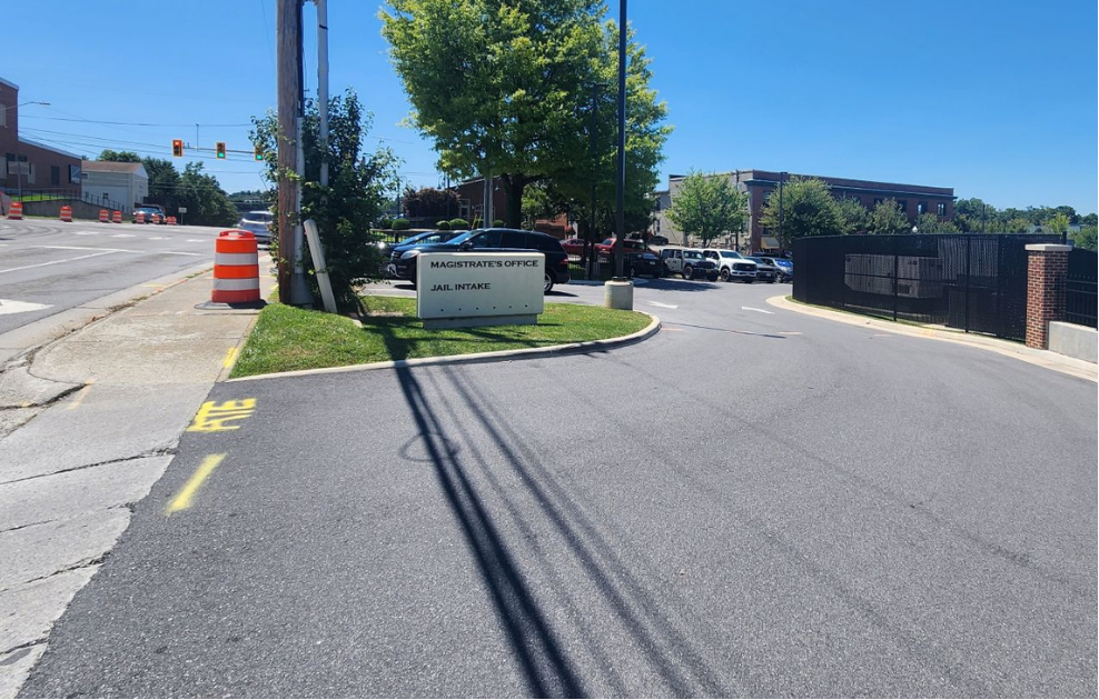 Visitor parking lot entrance on First Street SE at the Montgomery County Magistrate's Office and Jail Intake in Christiansburg, VA